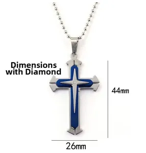 Detailed view of 44mm by 26mm triple-layer cross pendant with blue inlay and diamond