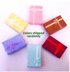 Set of six colorful cardboard jewelry gift boxes with elegant ribbon bow decorations