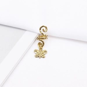 Detail of antique gold spiral hair jewelry featuring a butterfly pendant for braids
