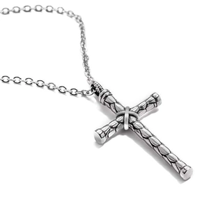 Close-up of silver cross pendant with scale texture on a classic steel O-chain