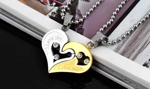 Detail of heart-shaped puzzle pendants with sparkling crystals and I love you engraving