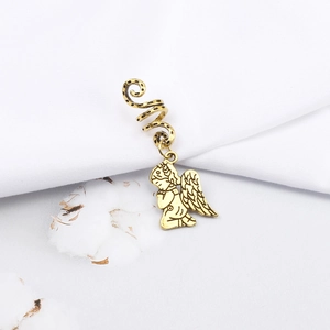 Detail showing vintage gold angel pendant and spiral hair ring for dreadlocks styles