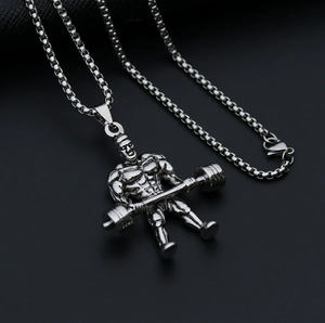 Close-up of vintage silver barbell weightlifter pendant with box chain in titanium steel