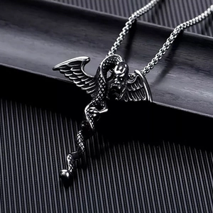 Macro shot of vintage dragon pendant with wings on high-quality stainless steel necklace