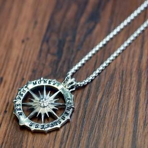 Detailed view of sun god pendant featuring success power money respect engravings