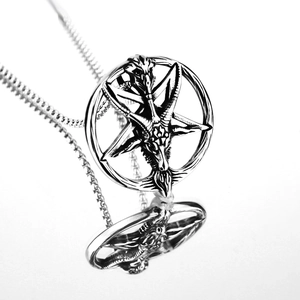 Detailed view of the Baphomet goat head and inverted hexagram on vintage steel necklace