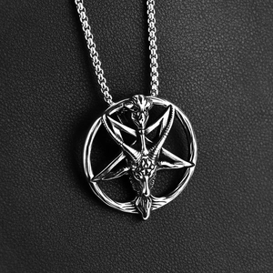 Detailed close-up of retro silver Baphomet goat and hexagram pendant on a ball chain