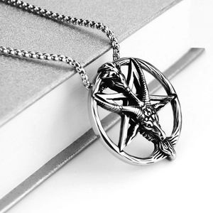Close-up of vintage Baphomet goat head pendant with detailed silver hexagonal star texture