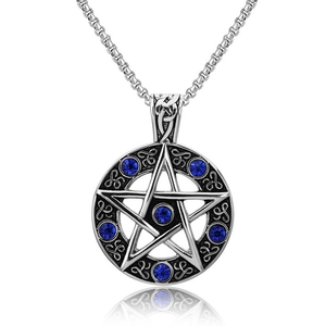 Macro shot of silver pentagram pendant with blue rhinestones and vintage finish