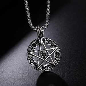 Macro view of vintage silver pendant with pentagram design and black rhinestones