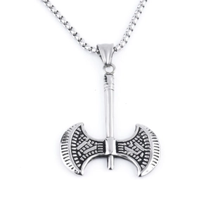 Macro detail of Viking axe pendant with geometric relief and steel chain texture