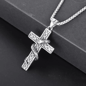Gothic silver snake wrapped cross pendant necklace with engraved details on a round box chain
