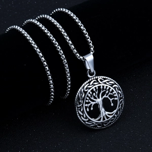 Detailed macro shot of vintage Tree of Life pendant with Celtic knot on box chain