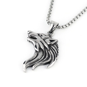 Macro detail of vintage wolf head pendant with punk style textures and aged silver finish