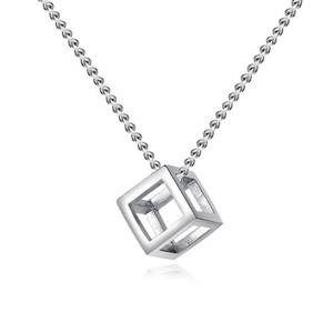 Macro detail of silver geometric hollow cube pendant on fine link chain necklace