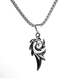 Detailed macro view of vintage flame pendant with textured silver box chain necklace