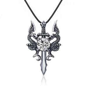 Gothic silver sword pendant with dragon carvings and clear gemstone on black cord
