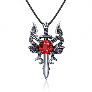 Vintage silver dragon sword pendant with a large red round gemstone on a black cord necklace