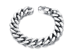 Macro detail of high-polished stainless steel Cuban link bracelet with lobster clasp