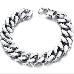 Polished silver stainless steel Cuban link bracelet with lobster clasp on white background