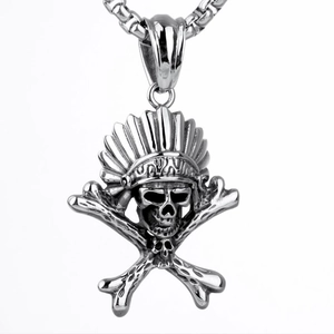 Macro shot of silver titanium steel skull pendant with an Indian feathered headdress