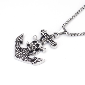 Detailed close-up of retro anchor and skull pendant with stainless steel square chain
