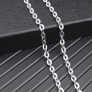 Polished silver stainless steel O-chain necklace with oval links on jewelry box