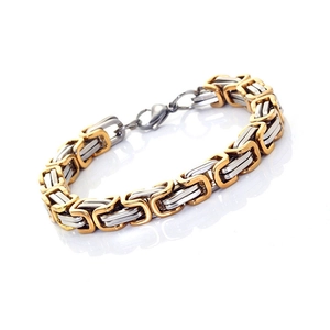 Detail of two-tone gold and silver stainless steel box chain bracelet with lobster clasp