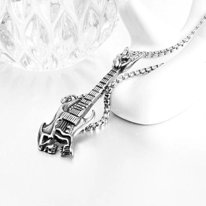 Detailed close-up of a silver electric guitar pendant with industrial box chain