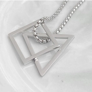 Minimalist silver geometric necklace with interlocking triangle and square pendants