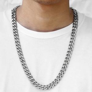 Polished stainless steel silver Cuban link chain necklace for men shown on white t-shirt