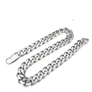 Detailed view of polished stainless steel Cuban link bracelet with a secure fold-over clasp