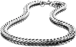 Macro shot of silver polished stainless steel Cuban link chain with high reflective finish
