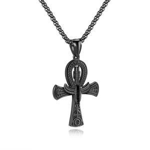 Detail of black Ankh cross pendant with intricate Egyptian hieroglyphs and scarab carving