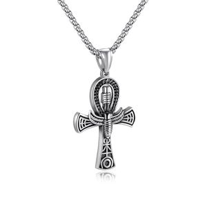 Close-up of silver Ankh cross pendant with intricate ancient Egyptian engravings