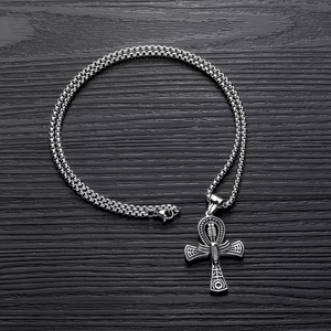 Silver Ankh cross pendant with box chain on dark wood background, hip-hop style necklace
