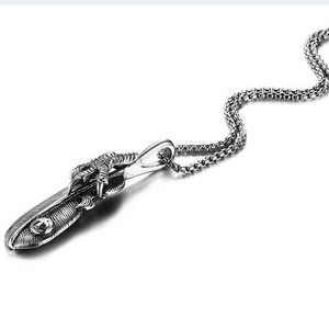 Vintage stainless steel necklace featuring a detailed eagle claw and feather pendant