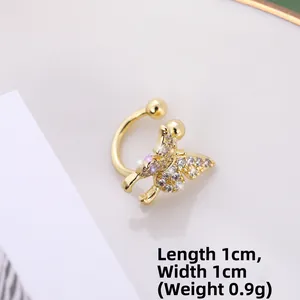 Macro shot of gold butterfly ear cuff with clear and purple zircon, size 1cm by 1cm