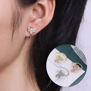 Detailed close-up of bee ear cuffs with cubic zirconia in gold, silver, and rose gold