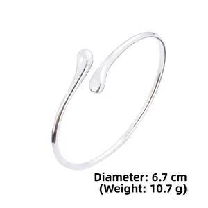 Detail view of silver teardrop open bangle showing 6.7cm diameter and 10.7g weight