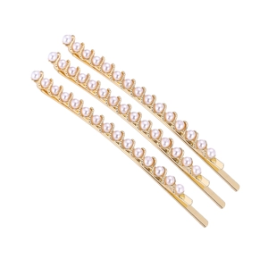 Set di tre eleganti fermagli per capelli dorati con perle bianche lucide