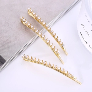 Set di tre fermagli per capelli dorati eleganti con file di perline bianche da donna