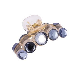 Elegant champagne resin hair claw with faceted navy blue crystals for women
