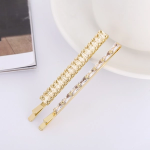Elegant gold hair clip set with sparkling champagne and clear square zircon stones