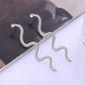 Gothic silver snake drop earrings with textured scales and sparkling crystal accents