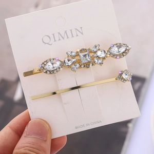 Two-piece rhinestone hair clip set with marquise crystals on gold-plated alloy