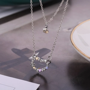 Collana doppia in argento con ciondolo a cuore scintillante e pietra di zircone