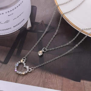 Collana doppia in argento con pendente a cuore scintillante e zirconi cubici rotondi