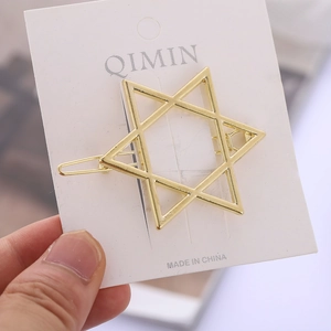 Polished gold hexagram star hair clip displayed on a white card for women hair styling