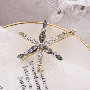 Elegant gold-plated snowflake hair clip with sparkling grey and clear rhinestones